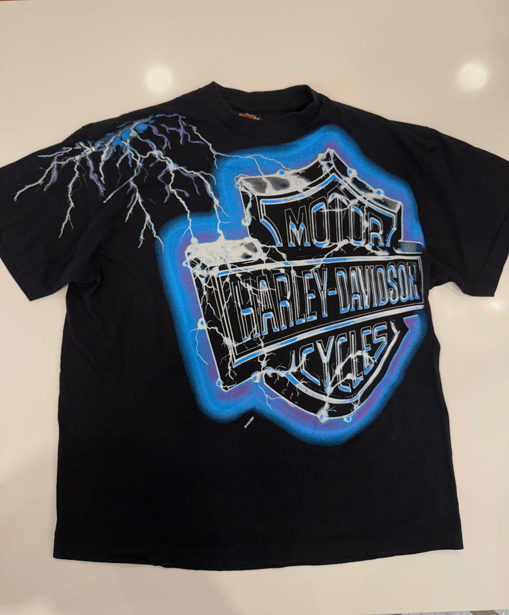 Striking bright blue lighting T shirt